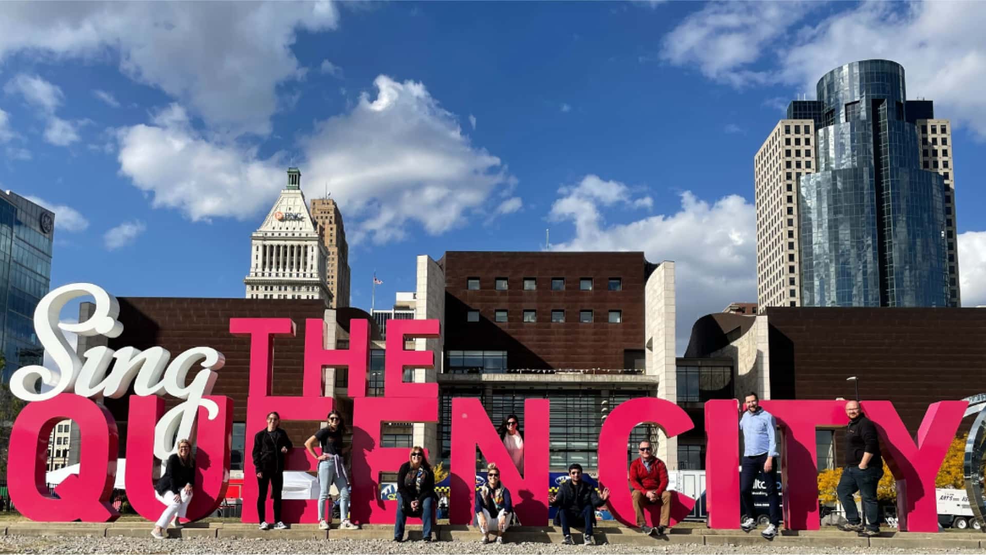 sing the queen city group photo. 